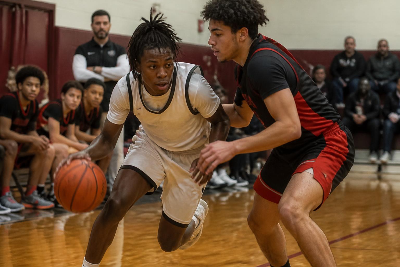 Two basketball players competing during a game